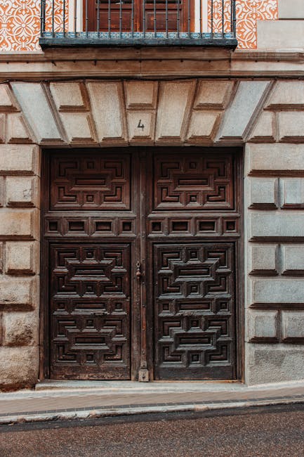 Ornate traditional wooden doors representing entry into knowledge